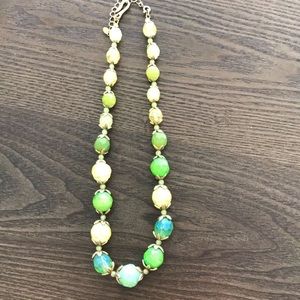 Fashion beaded necklace with gold tone  accents.